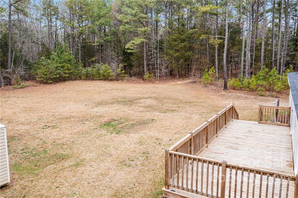 3205 Unity Church Road Lancaster, SC 29720 - Photo 41 of 45 a view of balcony with wooden floor and fence