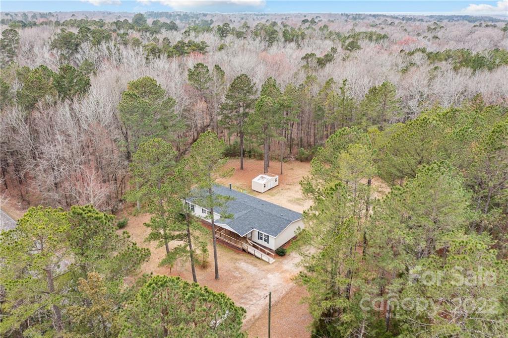 3205 Unity Church Road Lancaster, SC 29720 - Photo 43 of 45 an aerial view of a house with a yard and lake view