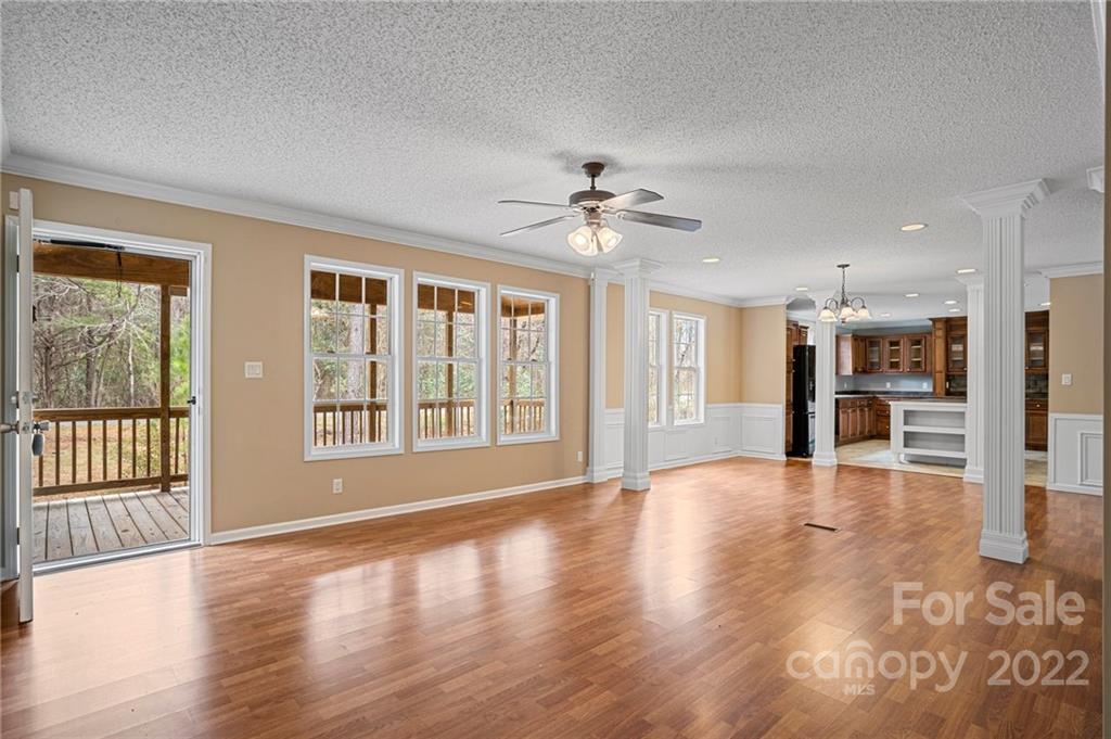 3205 Unity Church Road Lancaster, SC 29720 - Photo 5 of 45 a view of an empty room with wooden floor and a window