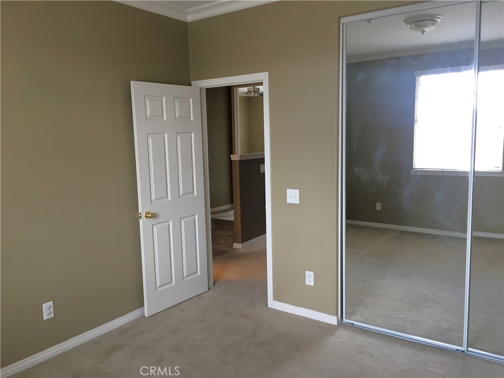 15213 Hawk Street Fontana, CA 92336 - Photo 12 of 20 wooden floor and window in a room