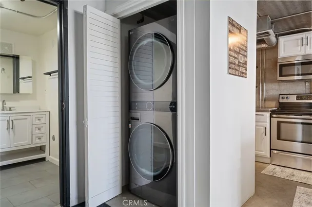 a view of a kitchen with washer and dryer