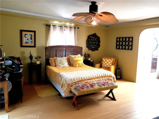 a bedroom with a bed and lamp