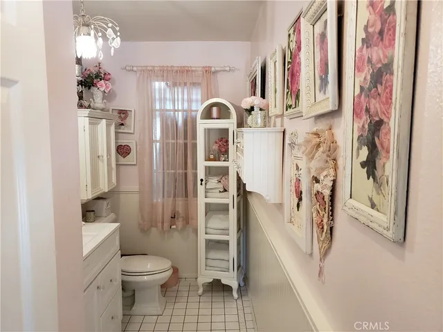 a bathroom with a toilet sink and shower