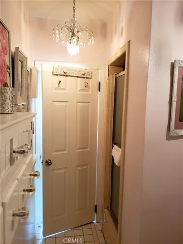 a bathroom with a mirror and a shower