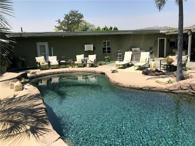 a view of a swimming pool with a patio