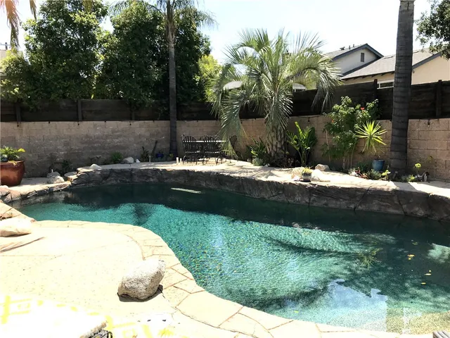 a view of a backyard of the house