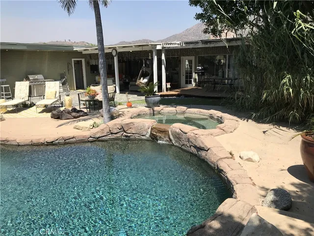 a view of a swimming pool with a patio