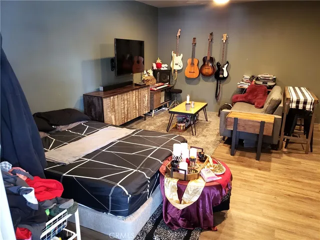 a living room with lots of furniture and a flat screen tv