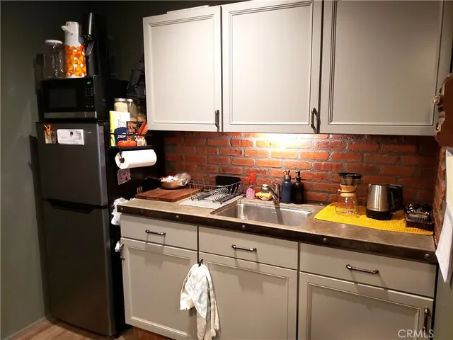 a kitchen with a sink and cabinets