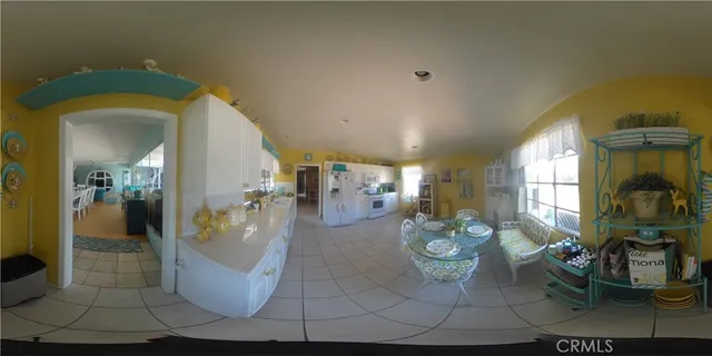 a view of a living room and dining room