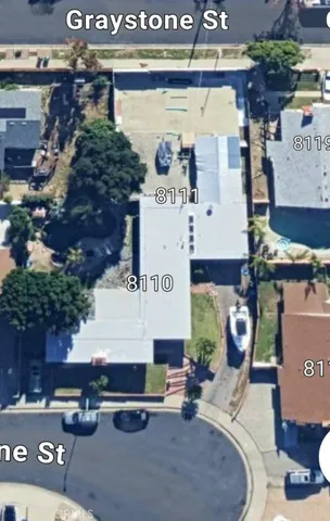 a building outdoor space with patio furniture and potted plants