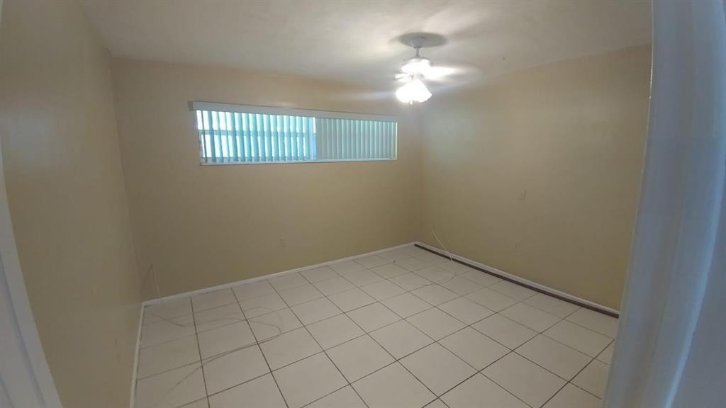8030 Sunset Strip Sunrise, FL 33322 - Photo 5 of 8 an empty room with windows