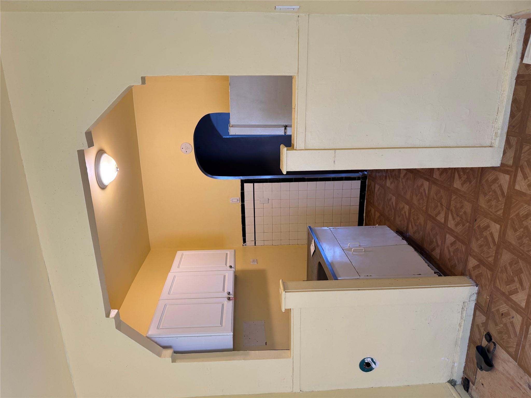 2922 Barnes Avenue, Unit 3A Bronx, NY 10467 - Photo 2 of 12 Kitchen with fridge and white cabinets