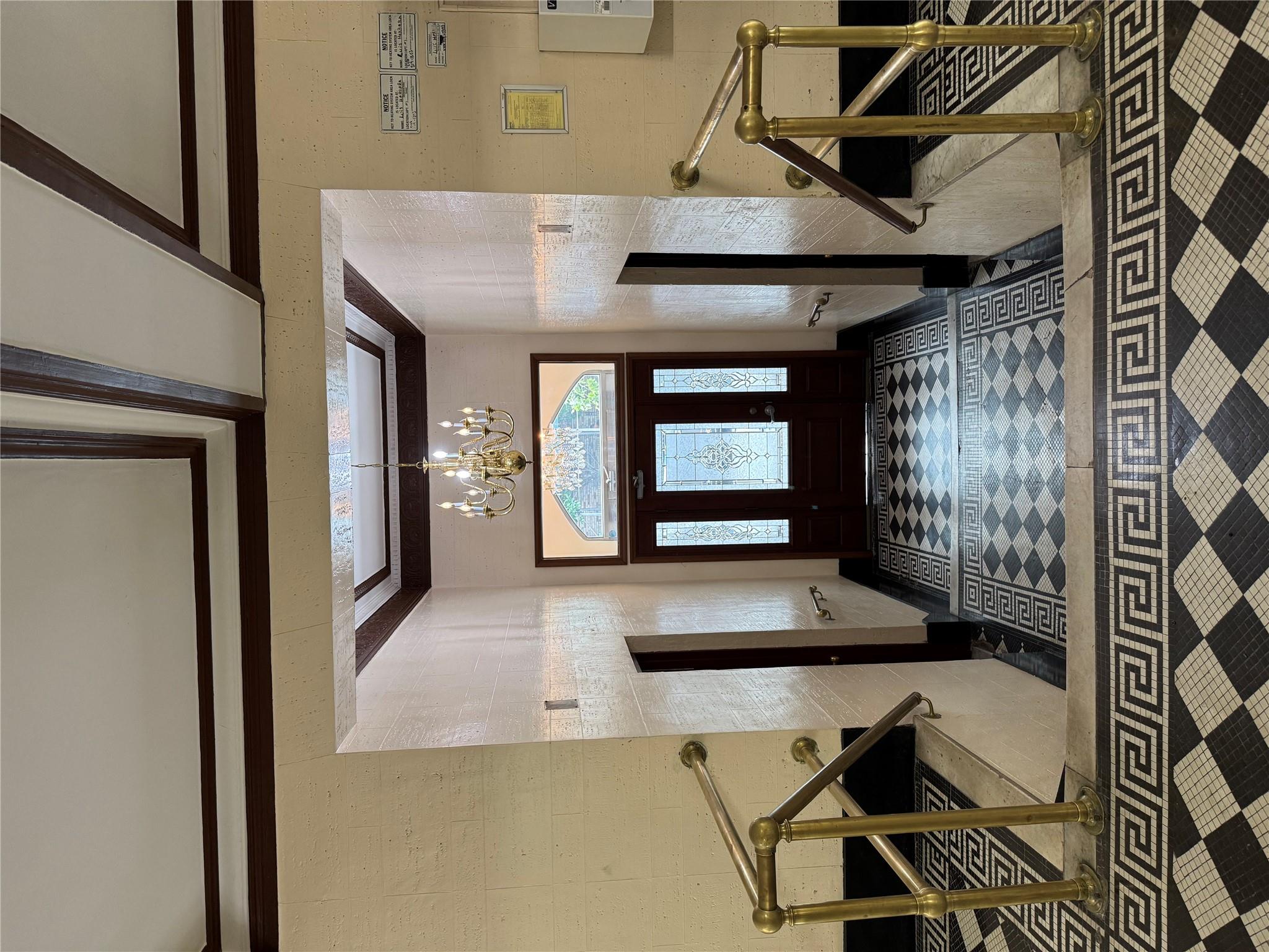 2922 Barnes Avenue, Unit 3A Bronx, NY 10467 - Photo 9 of 12 Foyer featuring a chandelier and ornamental molding