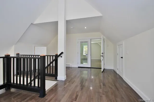 a view of entryway with wooden floor