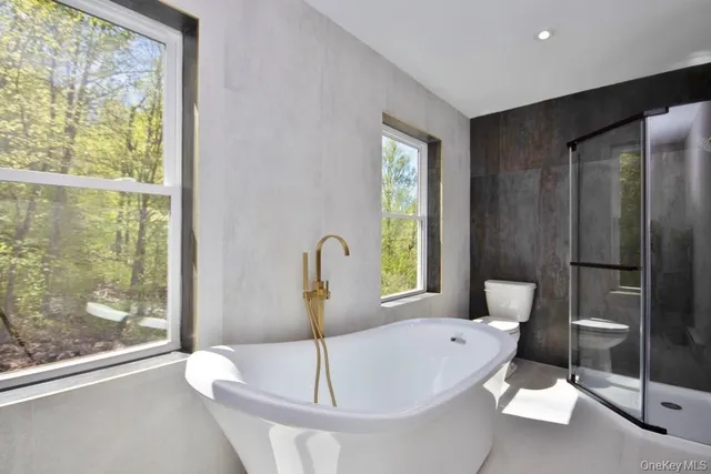 a living room with a large window and outer view