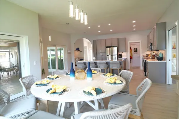 a front view of a house with a garden and trees