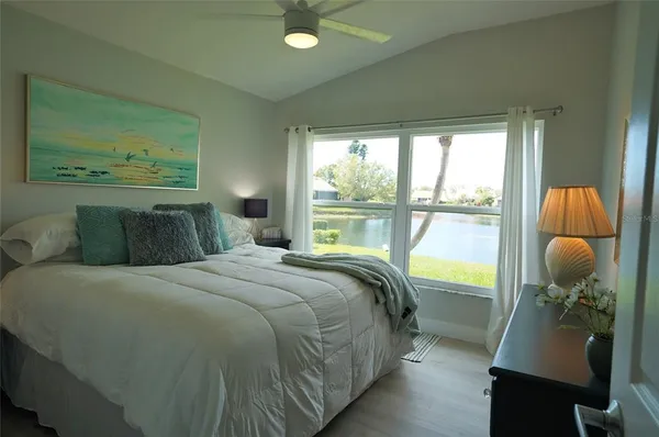 an aerial view of a residential houses with outdoor space and street view