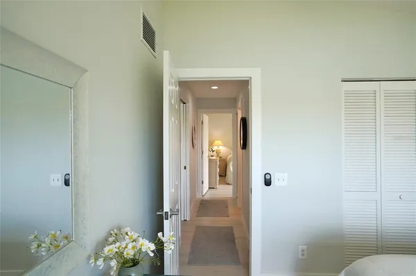 an aerial view of a house with a yard and lake view