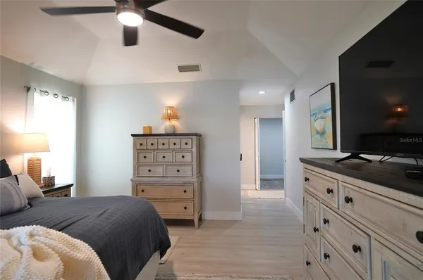 a view of a lake with boats and trees