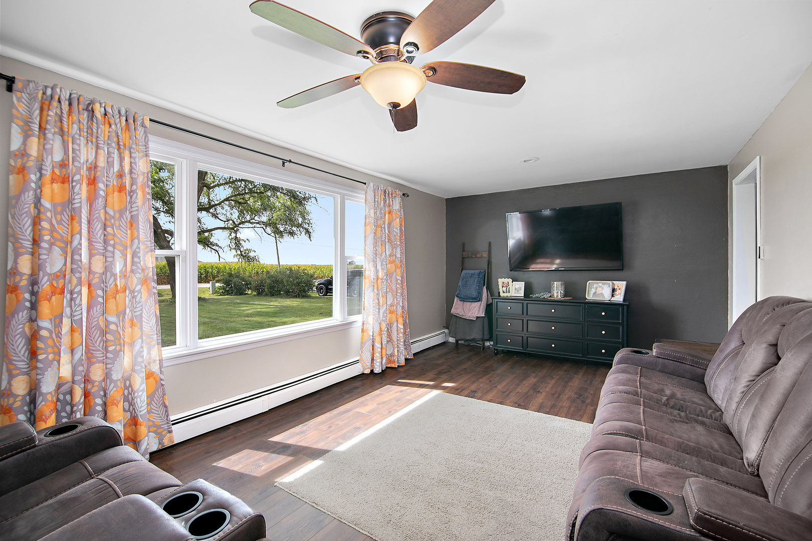1627 West 2000S Road Kankakee, IL 60901 - Photo 11 of 30 a living room with furniture and a flat screen tv