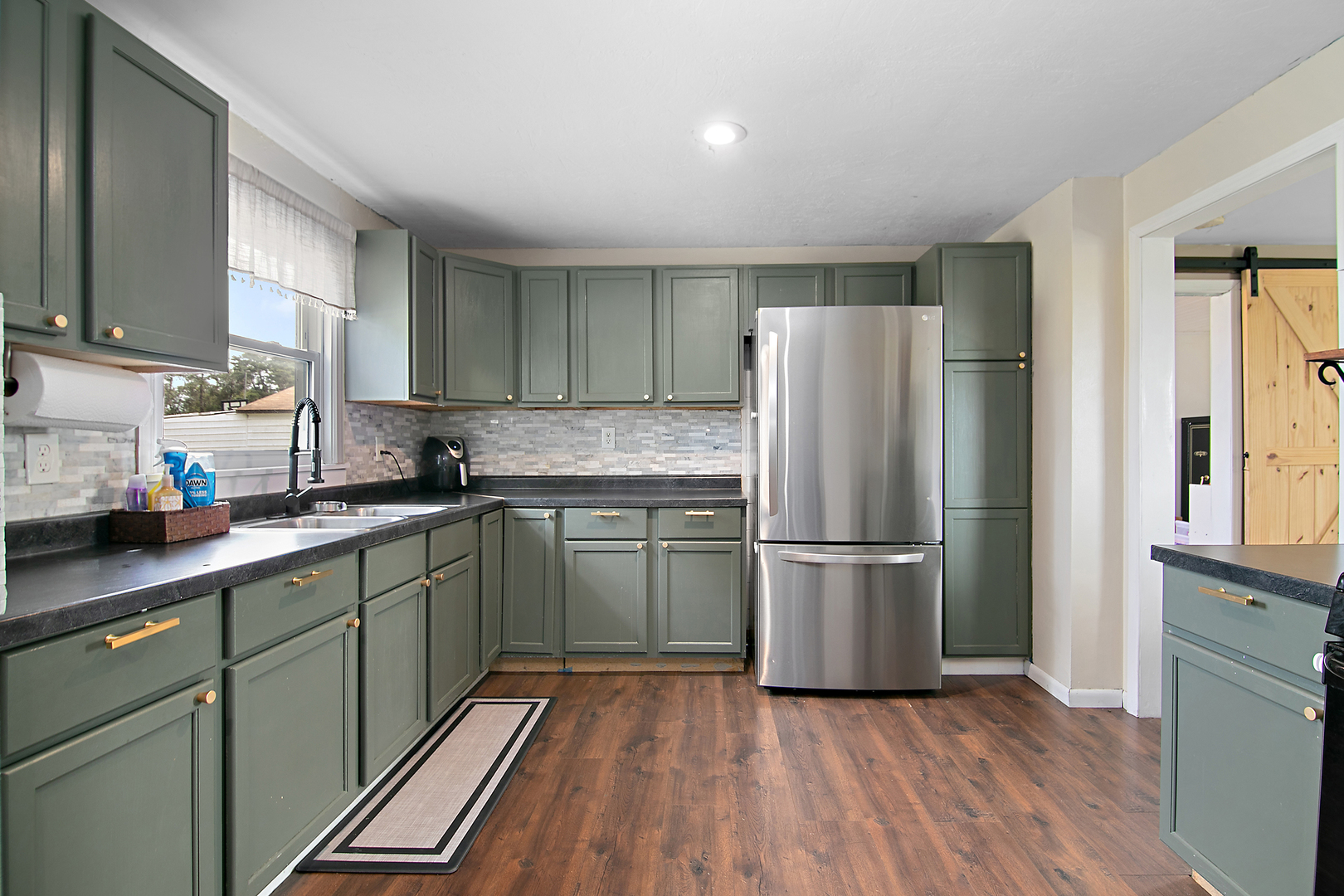 1627 West 2000S Road Kankakee, IL 60901 - Photo 17 of 30 a kitchen with a refrigerator and a sink