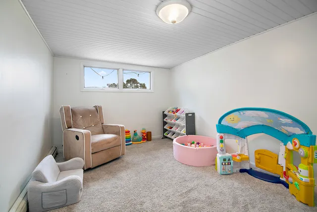 a bedroom with toys and a couch