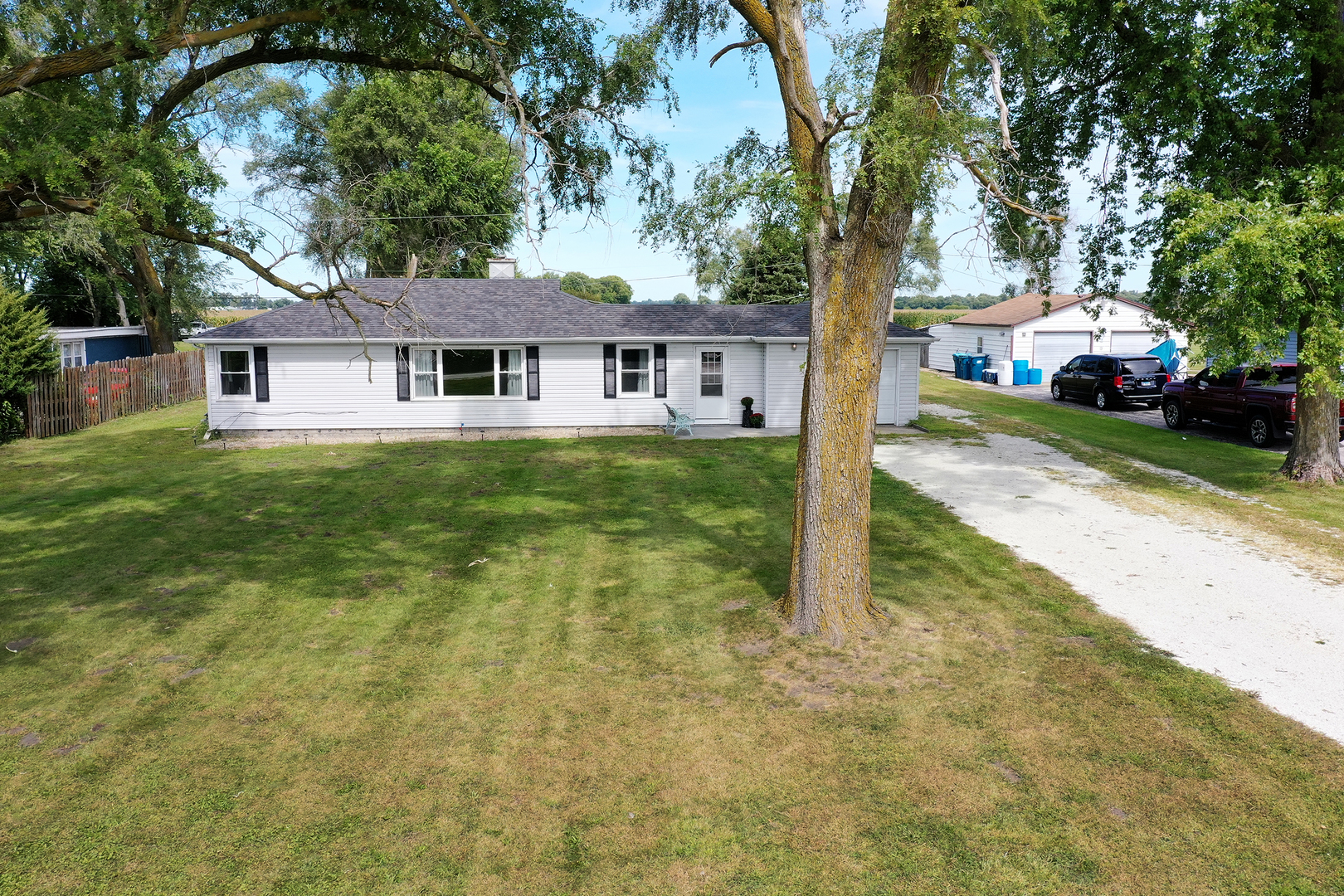 1627 West 2000S Road Kankakee, IL 60901 - Photo 2 of 30 a front view of a house with a yard and trees