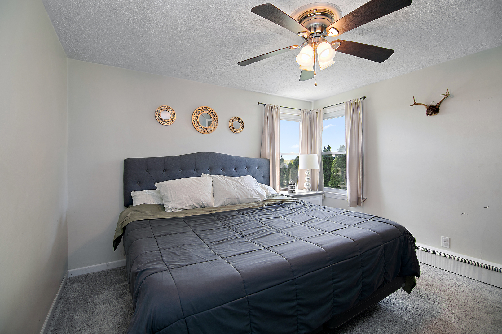 1627 West 2000S Road Kankakee, IL 60901 - Photo 23 of 30 a bedroom with a bed and a chandelier