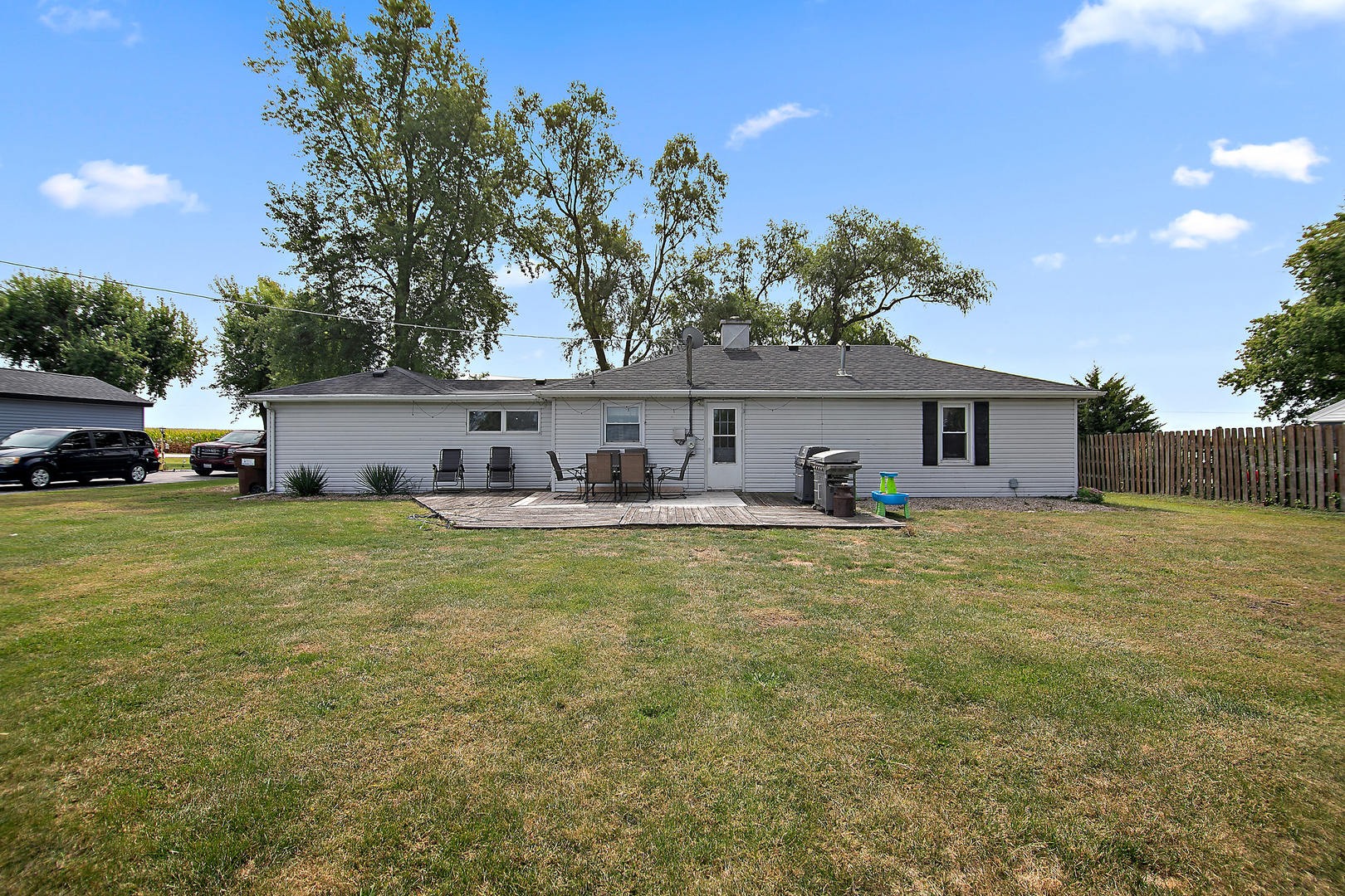 1627 West 2000S Road Kankakee, IL 60901 - Photo 26 of 30 a front view of house with yard and trees in the background