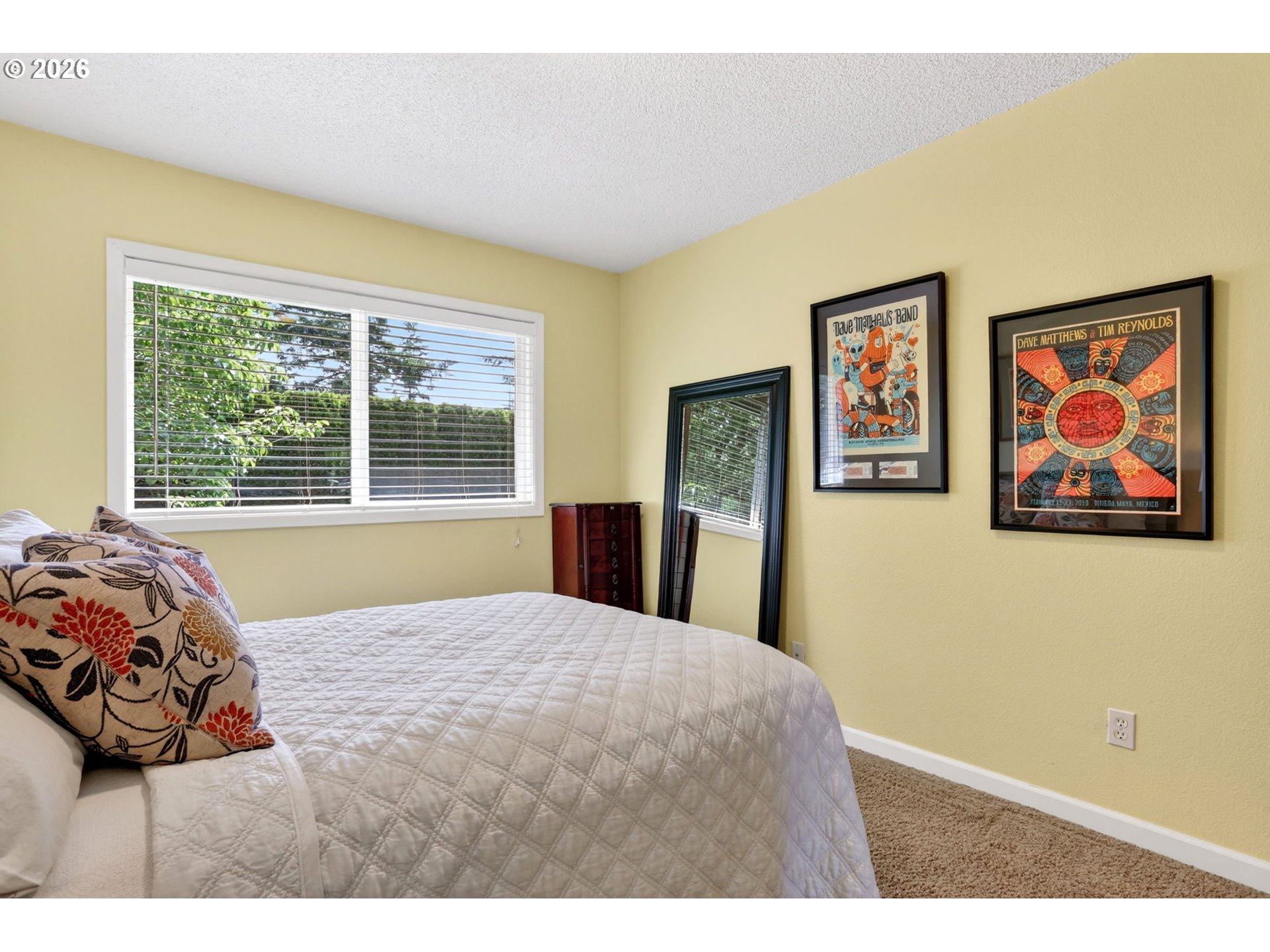 1776 Southeast 114th Place Portland, OR 97216 - Photo 38 of 47 a bedroom with a bed and a painting on the wall