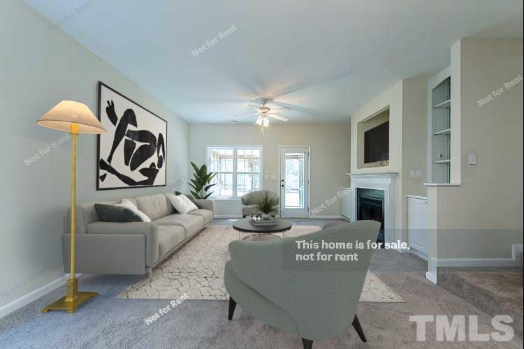 2109 Metacomet Way Raleigh, NC 27604 - Photo 2 of 17 a living room with furniture and a fireplace