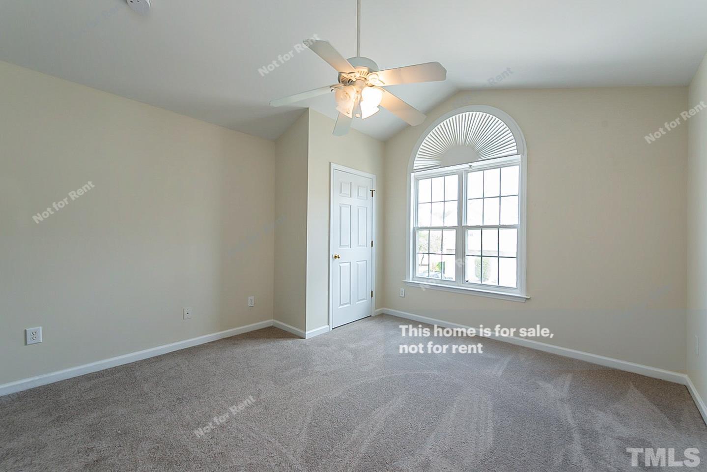 2109 Metacomet Way Raleigh, NC 27604 - Photo 11 of 17 an empty room with windows and chandelier