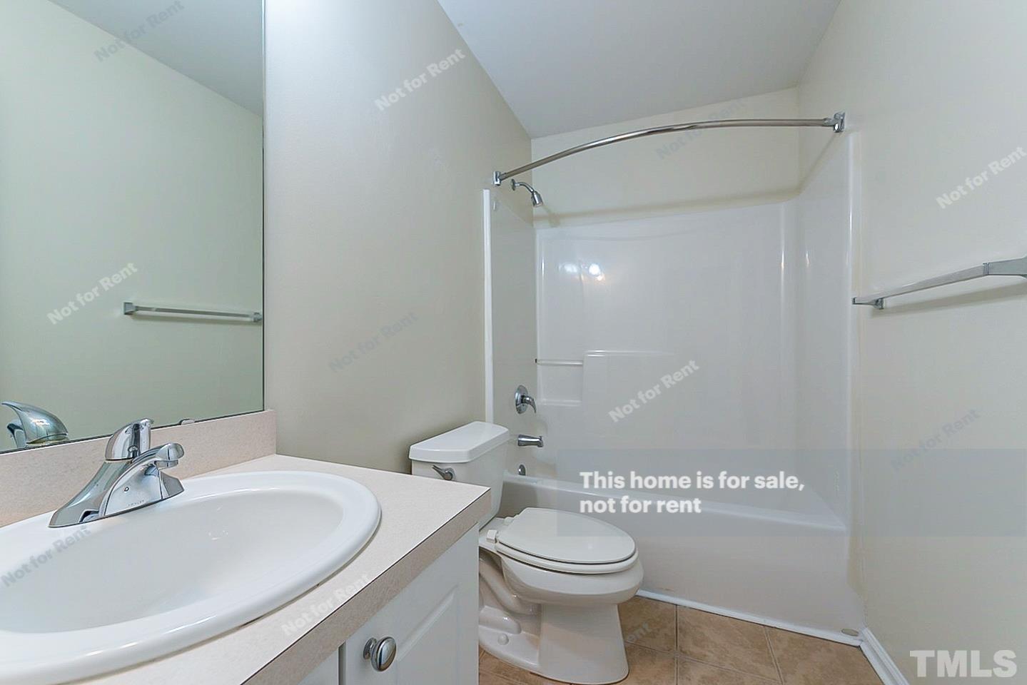 2109 Metacomet Way Raleigh, NC 27604 - Photo 13 of 17 a bathroom with a sink a toilet and shower