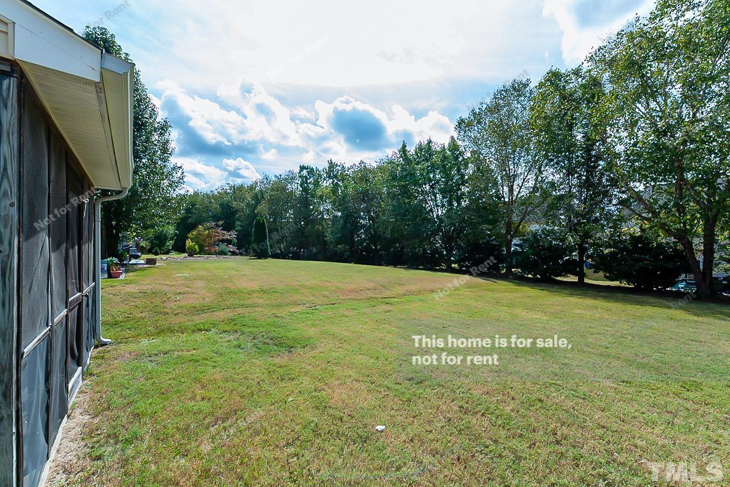 2109 Metacomet Way Raleigh, NC 27604 - Photo 16 of 17 a view of a yard with a house