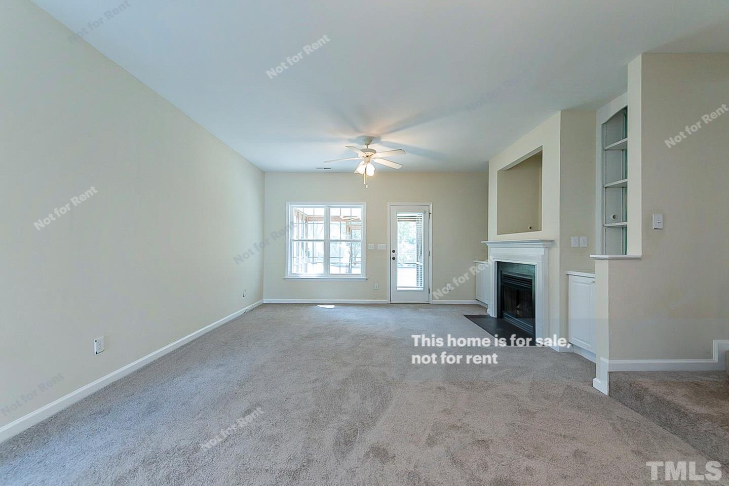 2109 Metacomet Way Raleigh, NC 27604 - Photo 3 of 17 a view of a livingroom with a fireplace and window