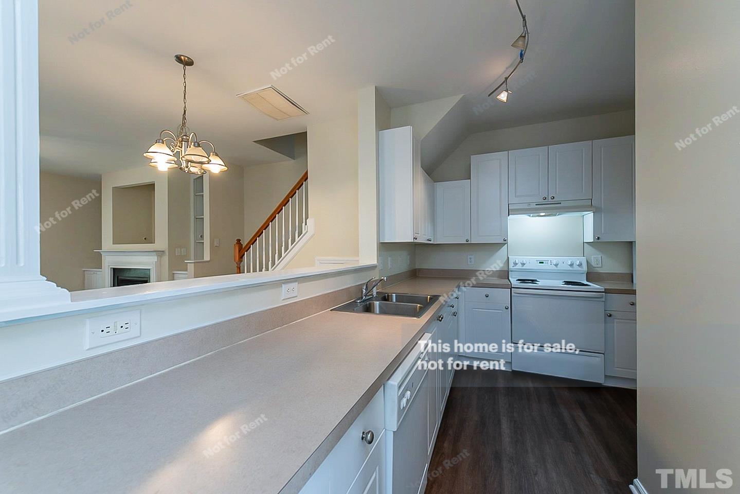 2109 Metacomet Way Raleigh, NC 27604 - Photo 6 of 17 a kitchen with a sink and stove