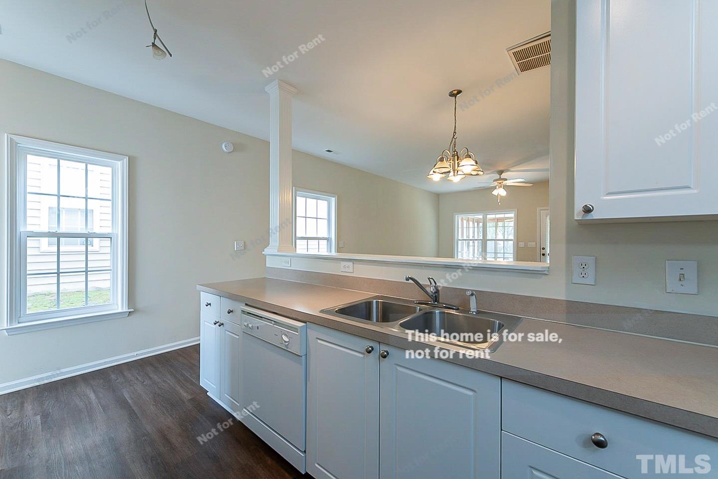 2109 Metacomet Way Raleigh, NC 27604 - Photo 7 of 17 a kitchen with granite countertop a sink stainless steel appliances and cabinets