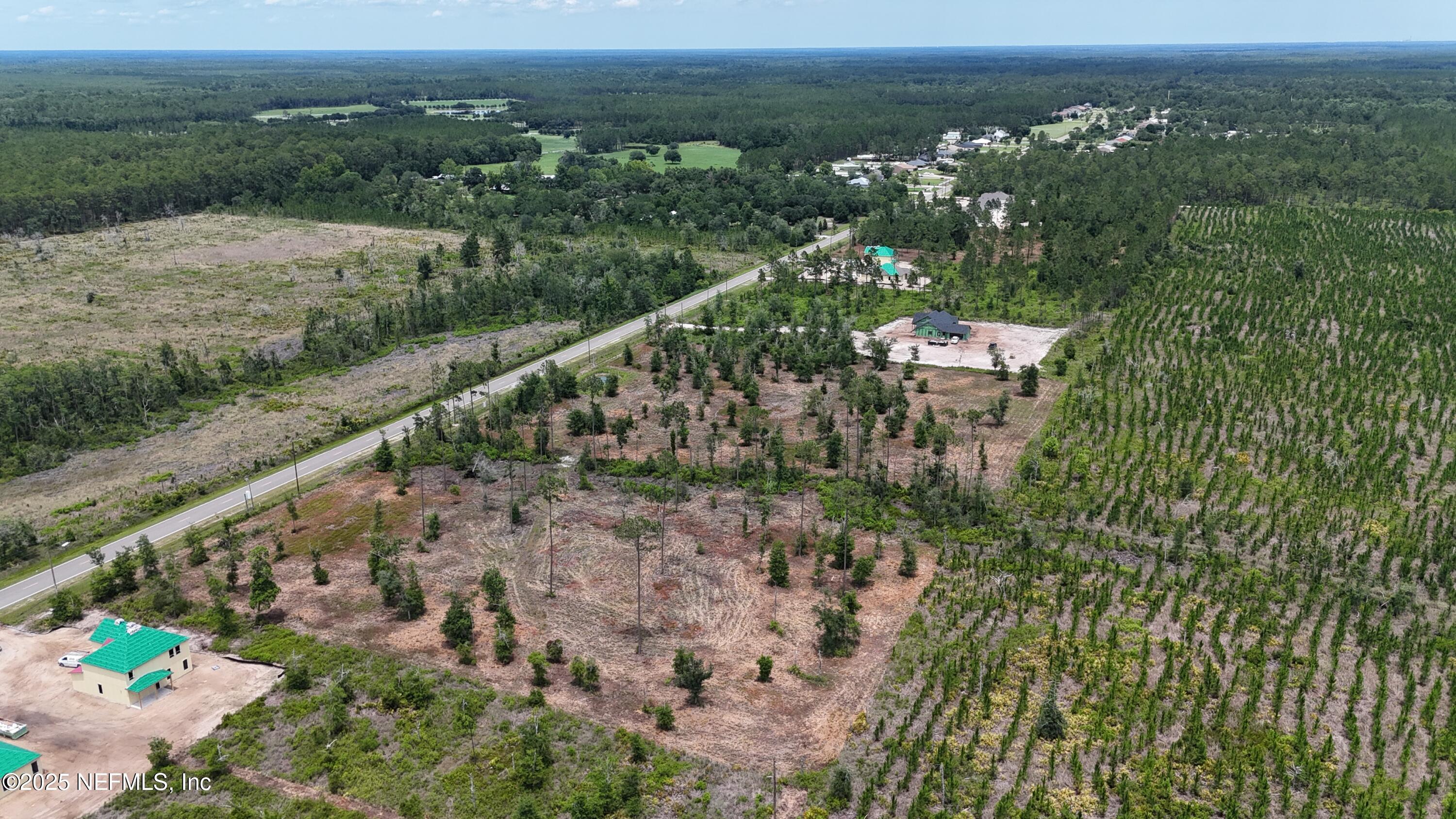 8623 Ford Road Bryceville, FL 32009 - Photo 6 of 10 a view of a city with lush green forest