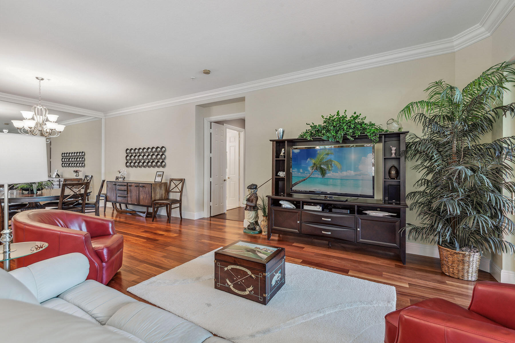 3189 Aviamar Circle, Unit 202 Naples, FL 34114 - Photo 4 of 50 a living room with furniture and a flat screen tv
