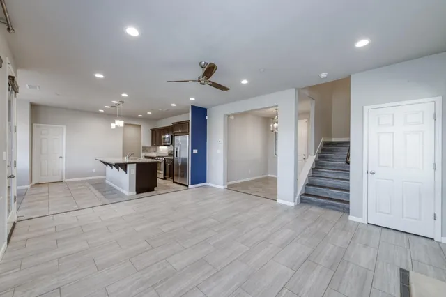 a view of kitchen with cabinets and stainless steel appliances