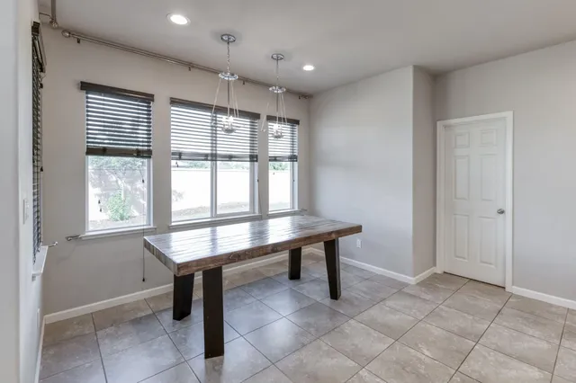 a view of a hallway with seating area