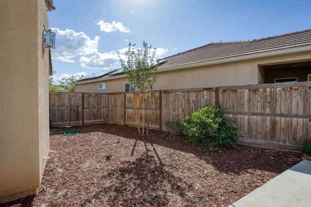 a backyard of a house with lots of green space