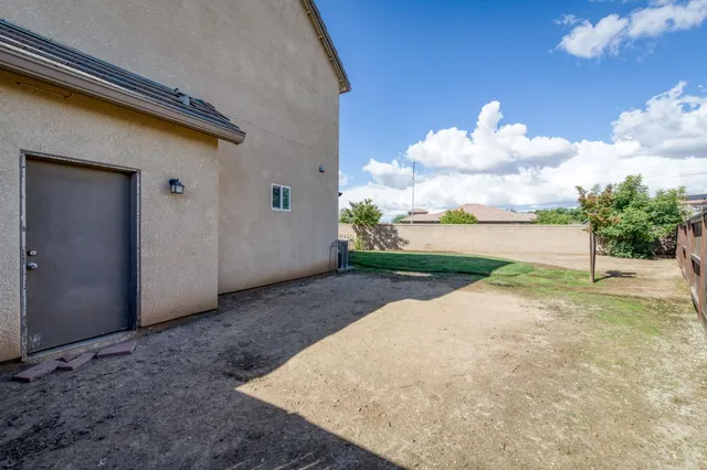 a view of a backyard of the house