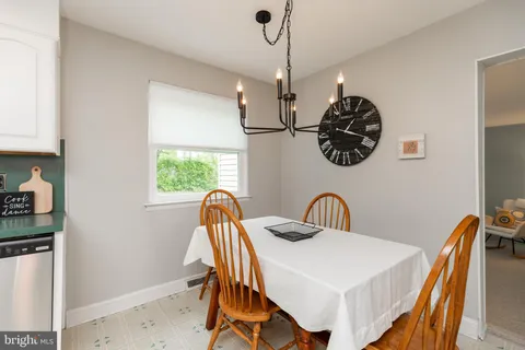 a view of a dining room and a chandelier