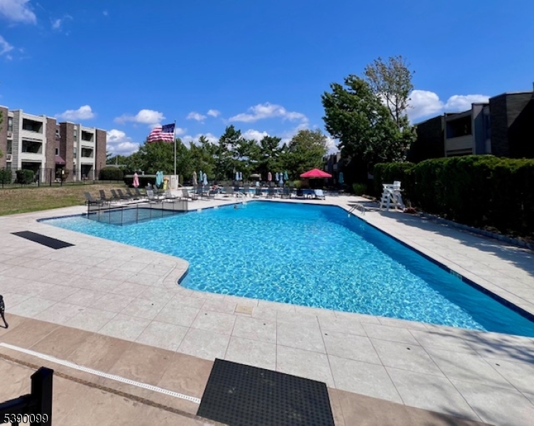 14 River Nutley Nj 07110, Unit F Nutley, NJ 07110 - Photo 14 of 17 a view of a swimming pool with a yard and plants