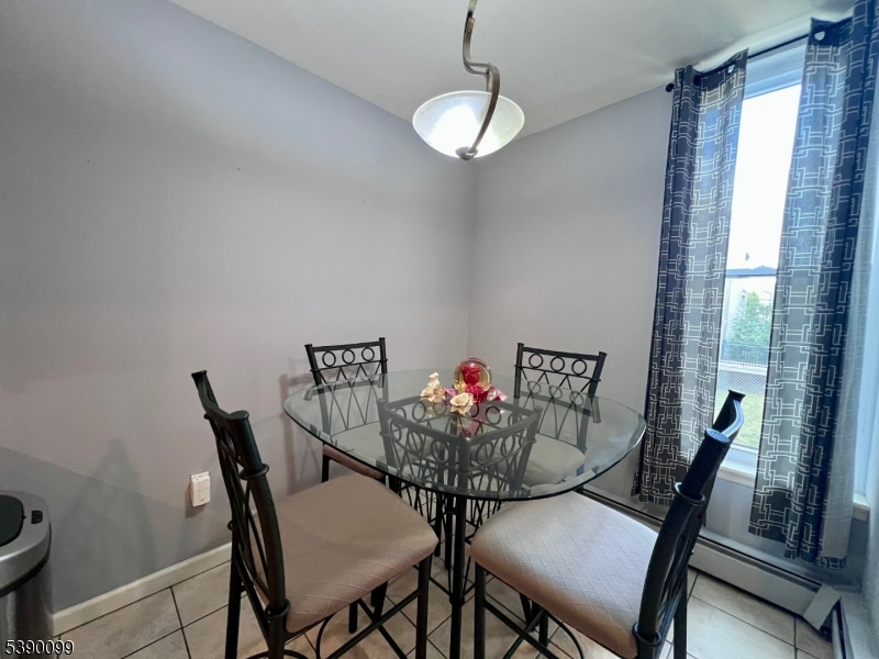 14 River Nutley Nj 07110, Unit F Nutley, NJ 07110 - Photo 8 of 17 a view of a dining room with furniture and window