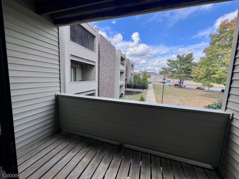 14 River Nutley Nj 07110, Unit F Nutley, NJ 07110 - Photo 9 of 17 a view of a balcony with furniture and a potted plant