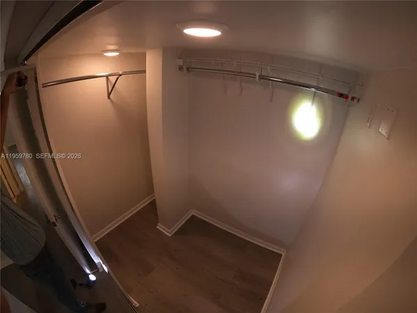 a bathroom with a shower and a mirror