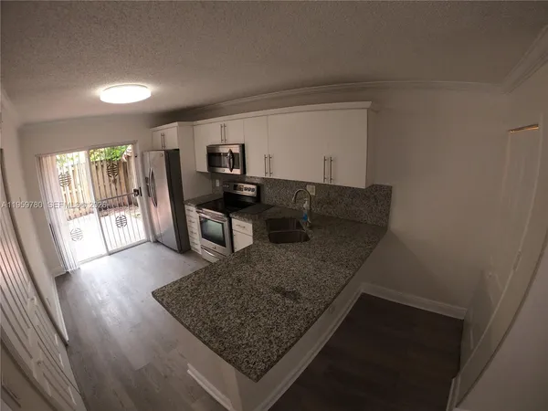 a view of a living room and dining room
